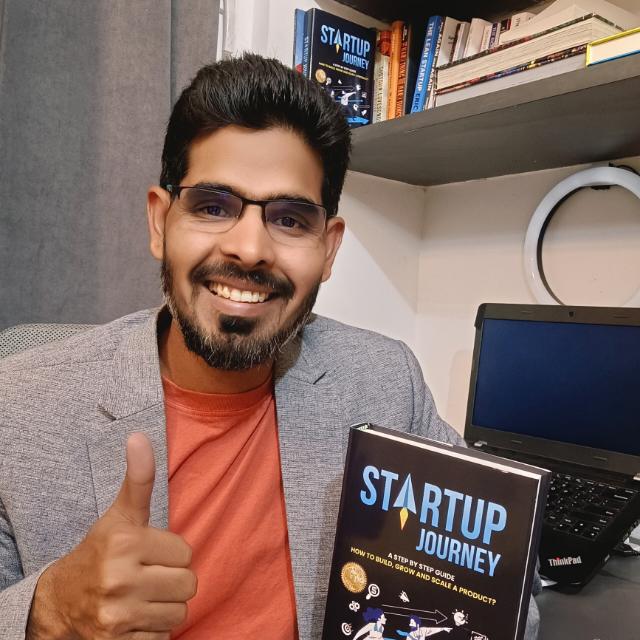 Imtiyaz Khan holding his book Startup Journey